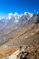 Diverse Group of People walking up on Mountain Trail