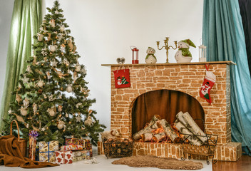 Christmas tree near fireplace in room