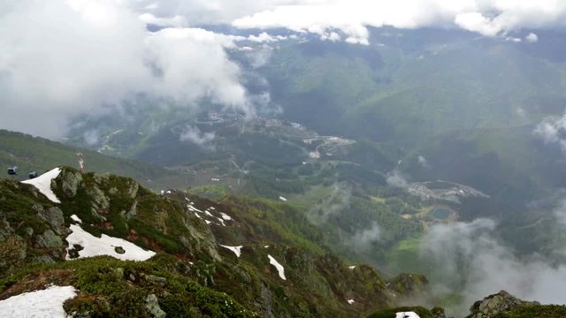 Cableway Gondola in mountains on a cloudy summer day