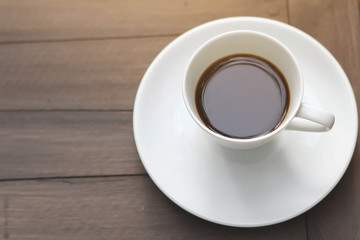 cup of coffee on the wooden table