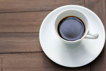 cup of coffee on the wooden table
