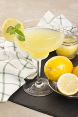 Fresh lemon refreshment drink with citrus slice on vintage backg