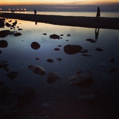 People on the coast. Sunset