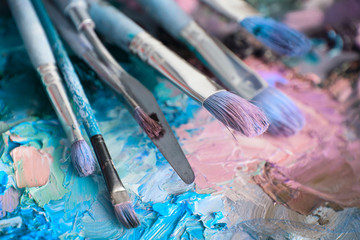 macro artist's palette, texture mixed oil paints in different co