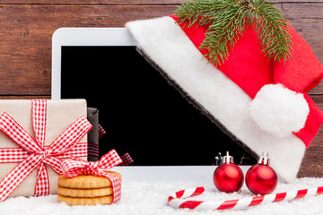 Christmas decoration and a tablet with copy space