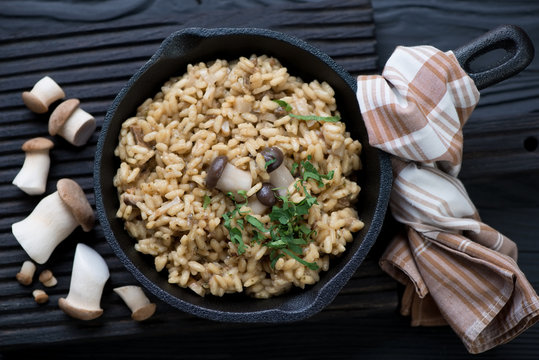 Risotto with porcini mushrooms served in a cast-iron pan