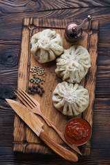 Georgian meat dumplings or khinkali with satsebeli and spices