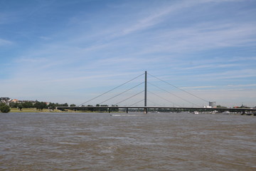 Fototapeta na wymiar River Rhine and Oberkasseler bridge in Düsseldorf, Germany