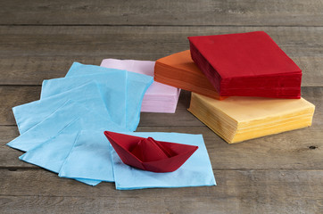 Paper napkins and paper boat