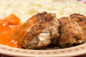 Minced meat meatballs with tomato sauce on the plate