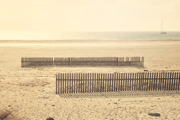 Wooden fences. Wooden protections on the beach to stop  sand