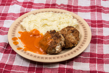 Minced meat meatballs with tomato sauce on the plate