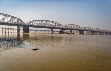 Fototapeta na wymiar Bally bridge a multi span steel structure over the river Ganges (Hooghly). Also known as the Vivekananda Setu it connects the Howrah district with Kolkata.