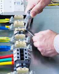 mounting electrical components on the circuit Board in the electrical Cabinet