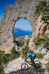 Fototapeta premium Sardinia between mountains and sea - Riding mountain bike