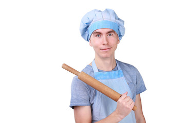 young  chef in uniform blue with rolling pin isolated over white