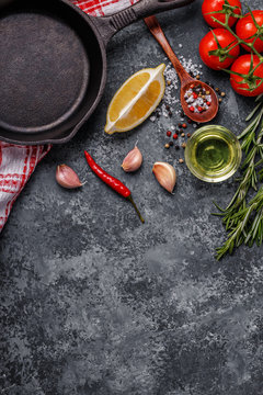 Background with spices, herbs, olive oil and pan for cooking.