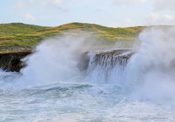 rough sea waves hitting the Aruba coast line