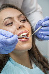 Young woman at the dentist, view from above