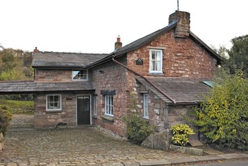 Fototapeta na wymiar View on an entrance area of english house. Sandstone residential