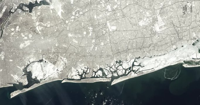 High-altitude overflight aerial of Long Beach. Clip loops and is reversible. Elements of this image furnished by NASA 