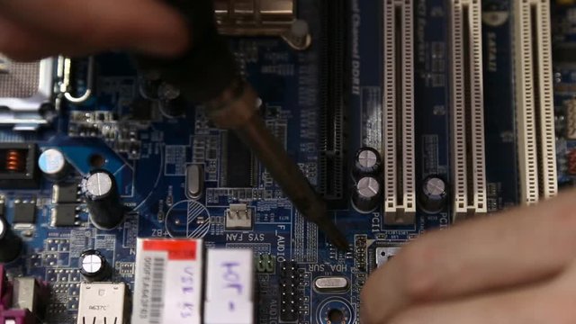 Master repairing computer board