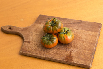 Raf tomatoes on cutting board,