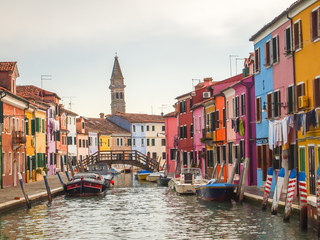 colorful street of burano island in venice, italy