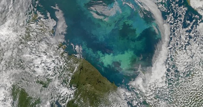 High-altitude overflight aerial of the Barents Sea. Clip loops and is reversible. Elements of this image furnished by NASA 