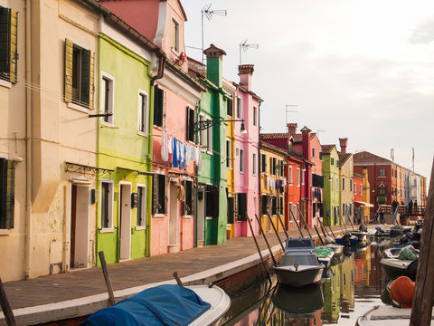 colorful street of burano island in venice, italy
