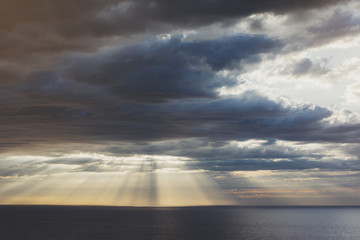 Clouds blue sky and sunlight sunset on horizon ocean . Сloudscape on background seascape dramatic atmosphere rays sunrise. Relax view waves sea, mockup nature evening concept.