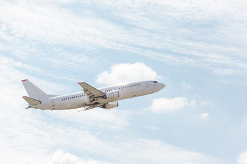 white plane takes off from the runway