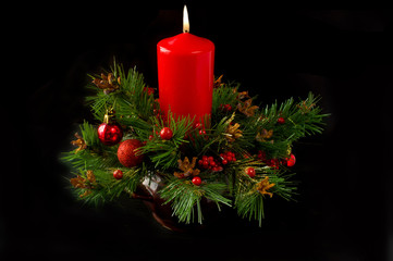 Christmas candle decoration on black background