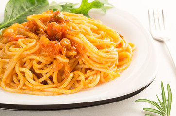 Italian spaghetti with vegetable sauce and herbs