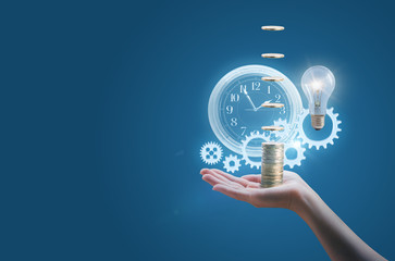 Fototapeta premium Business woman in the hand of a clock gears money and the lamp symbolizes the effective implementation of business ideas