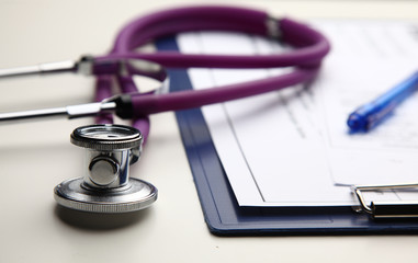 Closeup of a medical stethoscope with folder