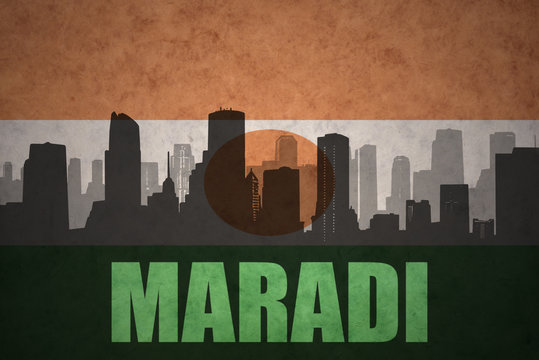 abstract silhouette of the city with text Maradi at the vintage niger flag