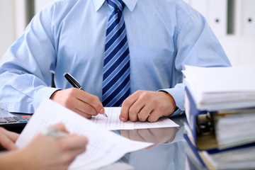 Fototapeta premium Bookkeepers or financial inspector making report, calculating or checking balance. Audit concept.