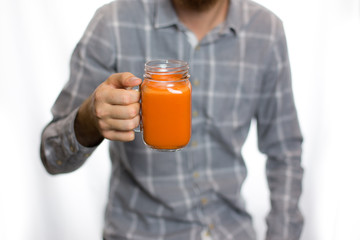 man holding a carrot juice diet is a healthy diet is useful