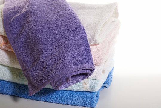 stack of towels on a white background