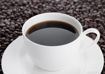Cup of black  coffee for breakfast with beans