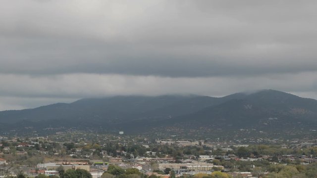 Cloudy timelapse of a small desert mountain town 