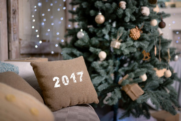 Obraz na płótnie Canvas Happy new year decoration. Merry christmas decoration. Christmas interior, sofa, pillow, Christmas tree, new year