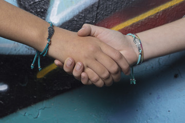 Two hands of friends caught