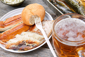 Meal consisting of smoked fish and beer