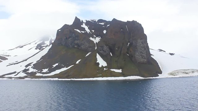 Severe high Arctic latitudes. Franz-Josef Land. Ziegler island with glaciers, snowfields and glacier-smoothed mountains