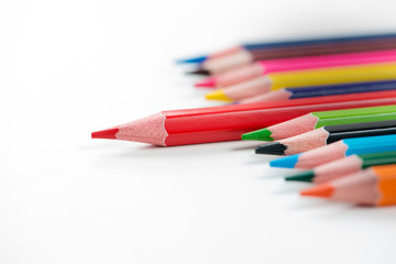 Colored pencils lined up in natural light