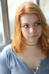 Red Haired Woman in Gray Button Down Top