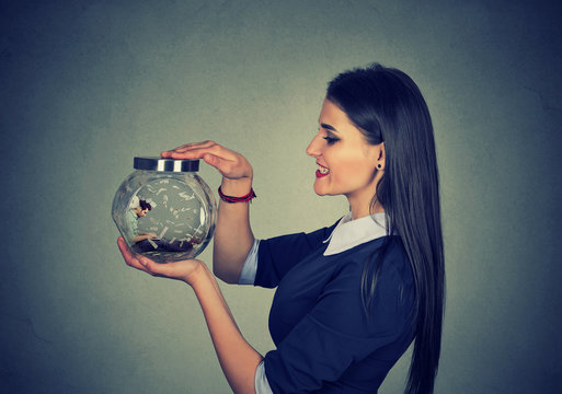 Woman Holding A Jar With Imprisoned Man In It