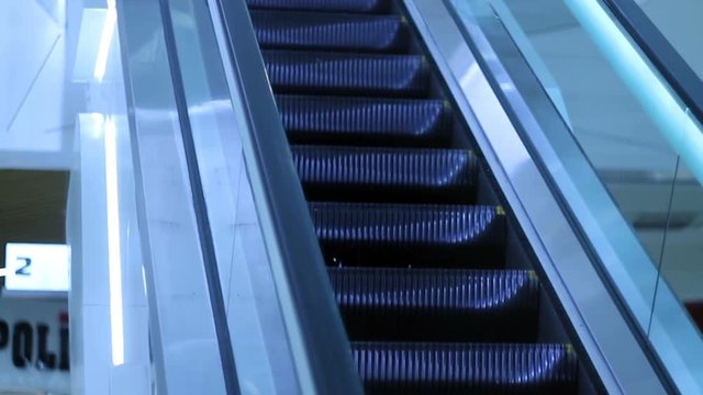 moving escalator up, mecanic, electic, Stair and escalators in a public area. hd footage 1080